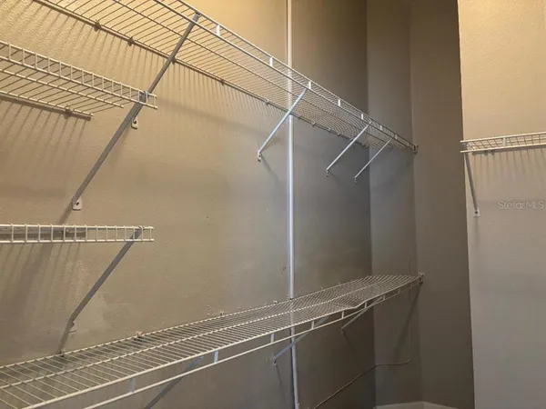 a view of a room with racks on the wall