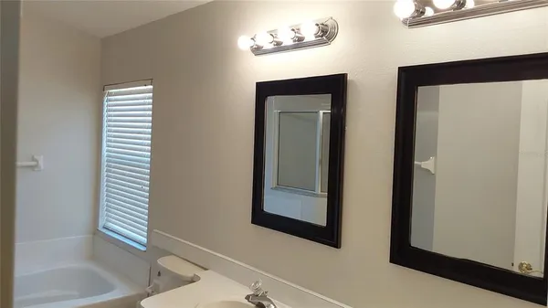 a bathroom with a bathtub and a sink