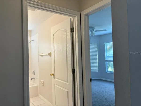 a view of a bathroom with a glass door