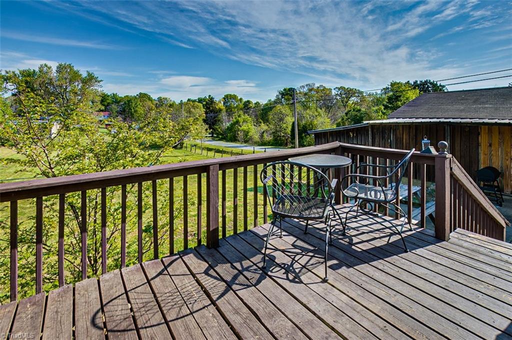 7008 Turnpike Road Archdale, NC 27263 - Photo 31 of 39 Back porch overlooking massive fenced back yard