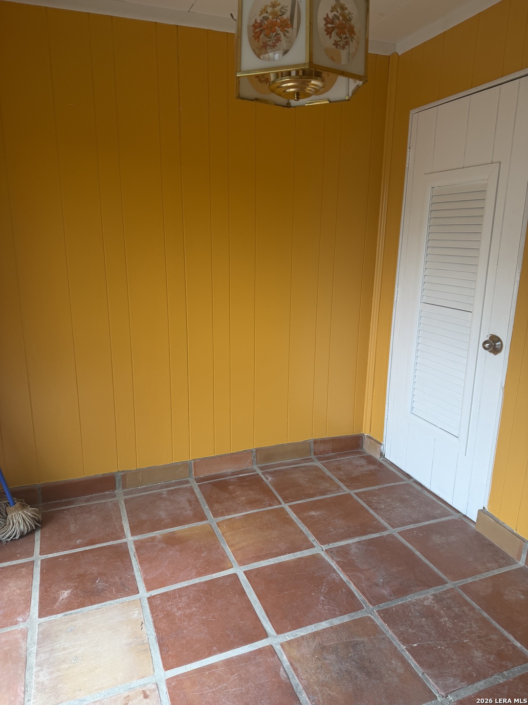 5435 Callaghan Road San Antonio, TX 78228 - Photo 13 of 38 a view of an empty room with wooden door