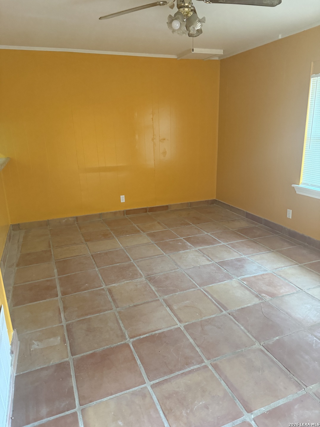 5435 Callaghan Road San Antonio, TX 78228 - Photo 16 of 38 a view of a room with an empty space and a window