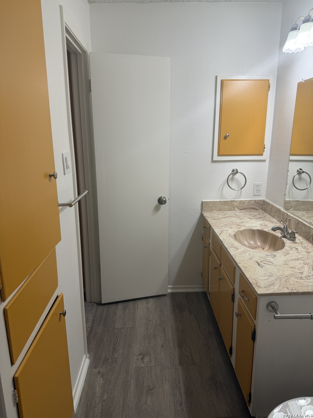 5435 Callaghan Road San Antonio, TX 78228 - Photo 17 of 38 a bathroom with a granite countertop sink and a mirror