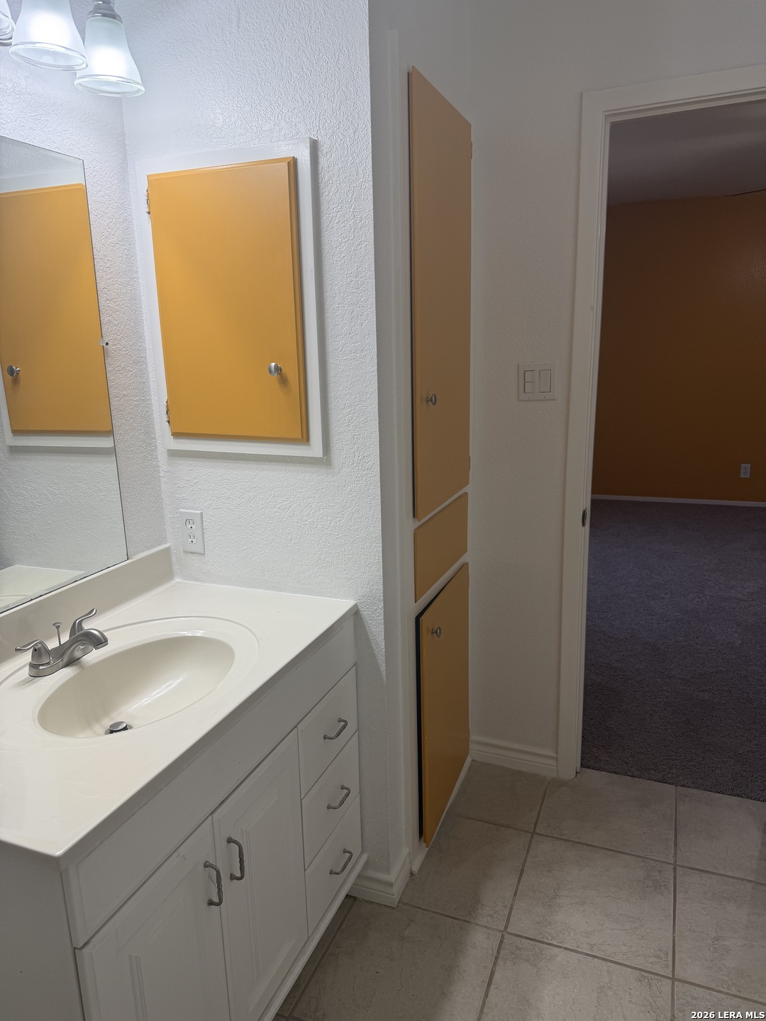 5435 Callaghan Road San Antonio, TX 78228 - Photo 19 of 38 a bathroom with a sink and a mirror