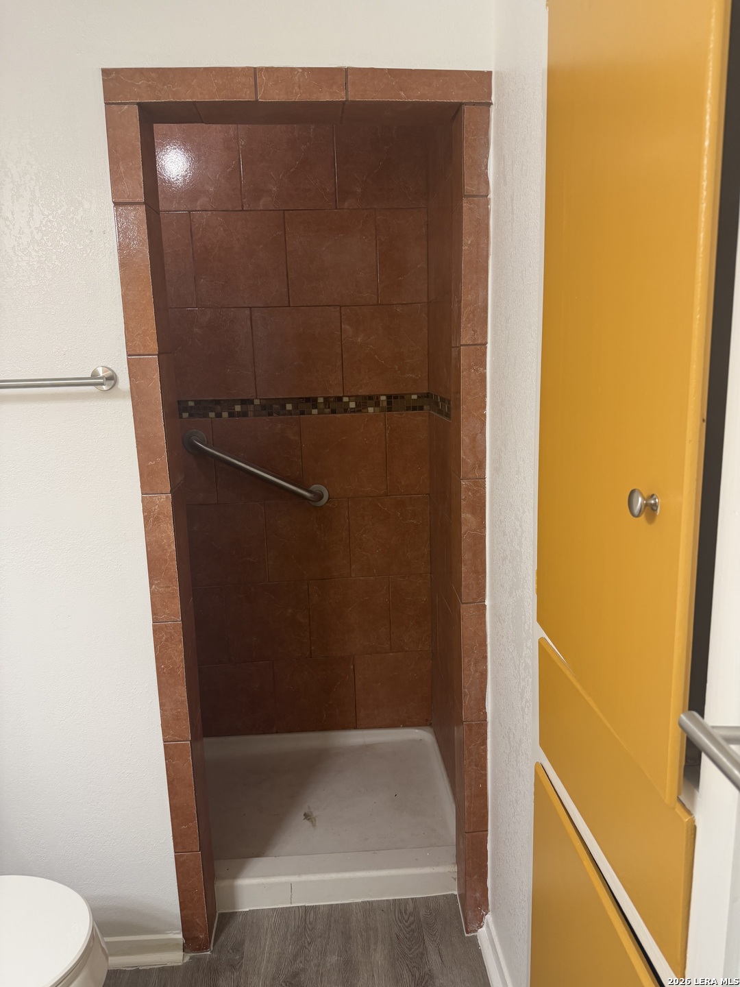 5435 Callaghan Road San Antonio, TX 78228 - Photo 26 of 38 a bathroom with a shower and toilet