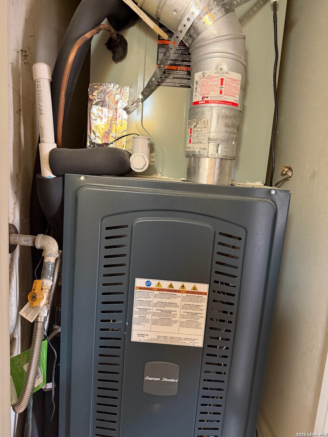 5435 Callaghan Road San Antonio, TX 78228 - Photo 34 of 38 a close view of water heater room