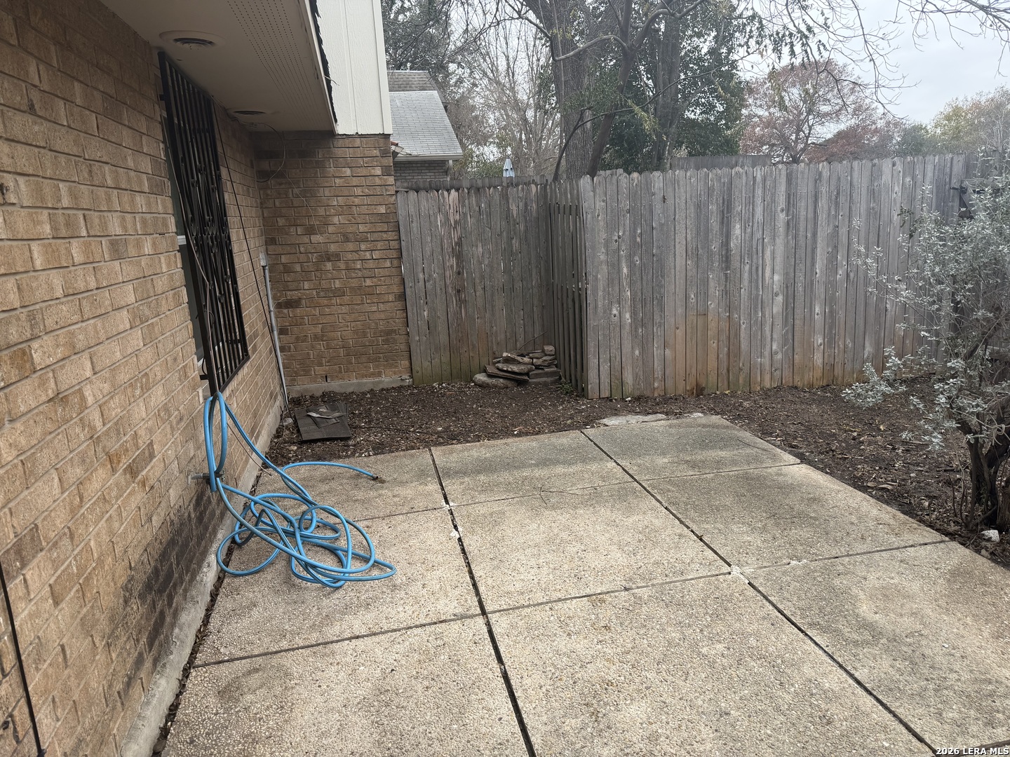 5435 Callaghan Road San Antonio, TX 78228 - Photo 35 of 38 a view of a backyard with wooden fence
