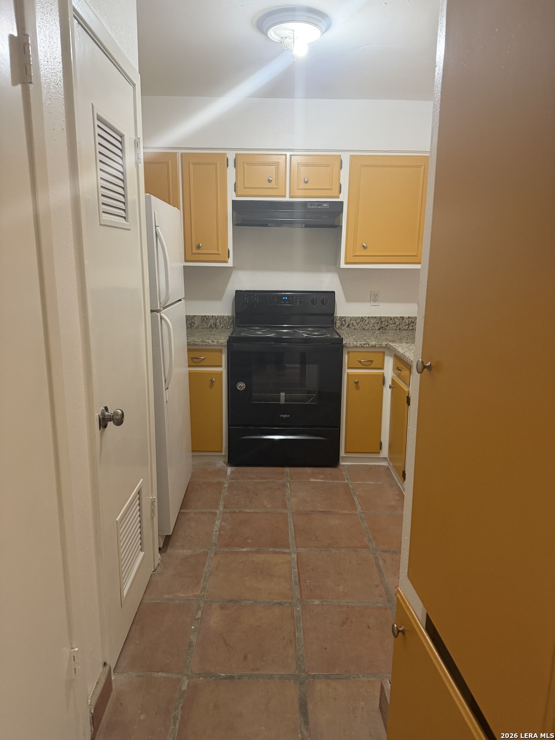 5435 Callaghan Road San Antonio, TX 78228 - Photo 4 of 38 a bathroom with a sink and a stove