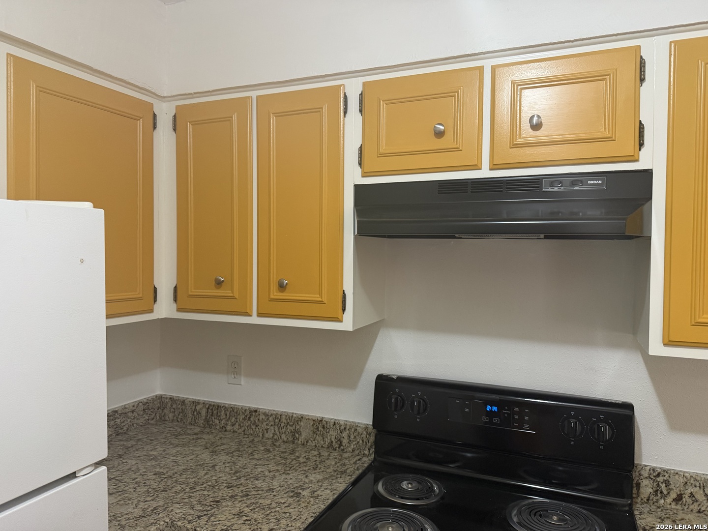 5435 Callaghan Road San Antonio, TX 78228 - Photo 5 of 38 a bathroom with a sink and a mirror