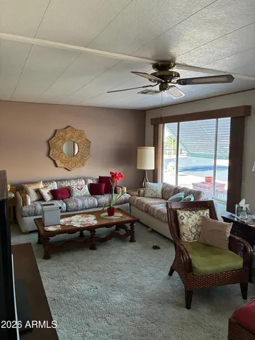 a kitchen with kitchen island granite countertop a sink cabinets and stainless steel appliances