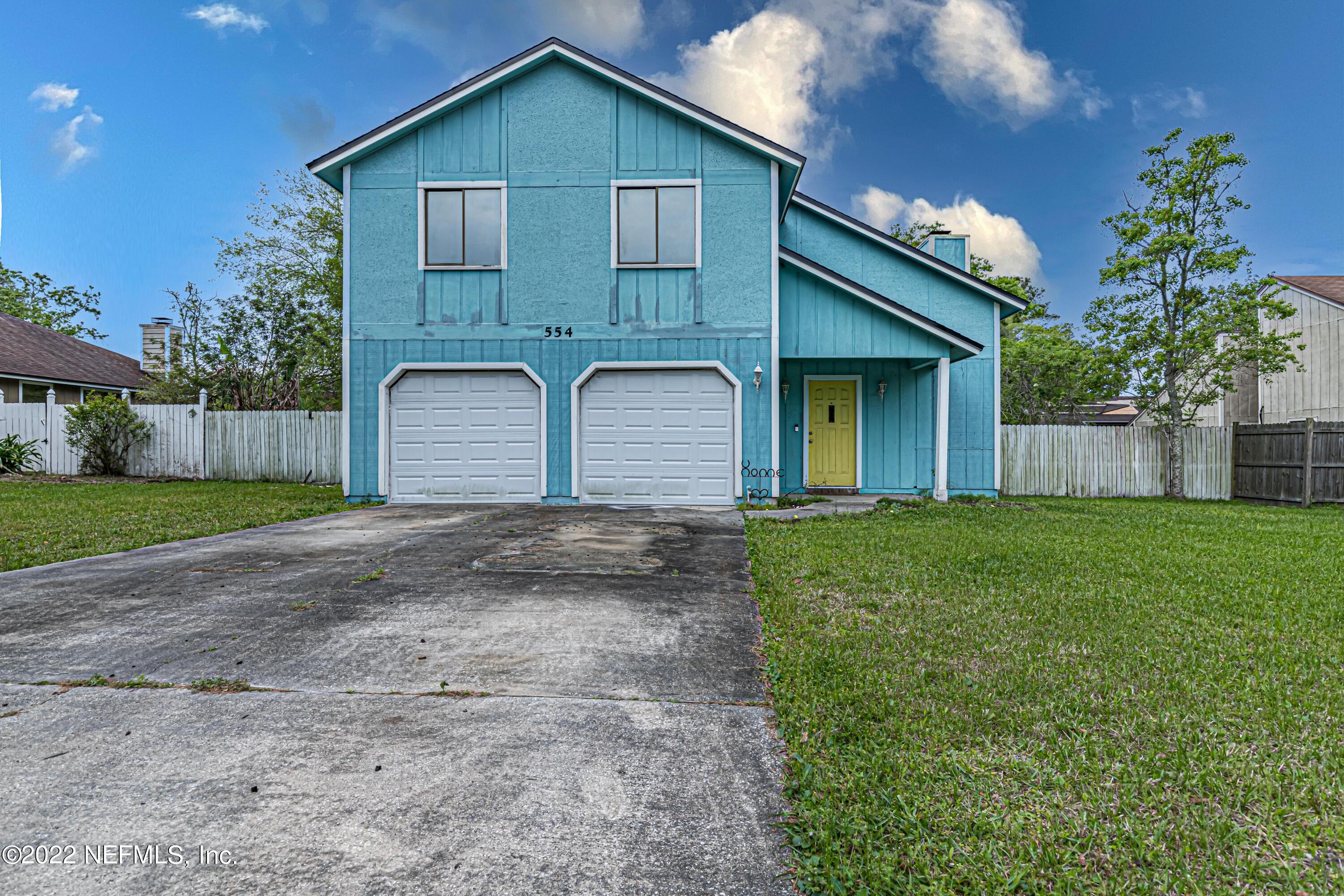 554 George Taylor Street Orange Park, FL 32073 - Photo 1 of 40 a house view with a garden space