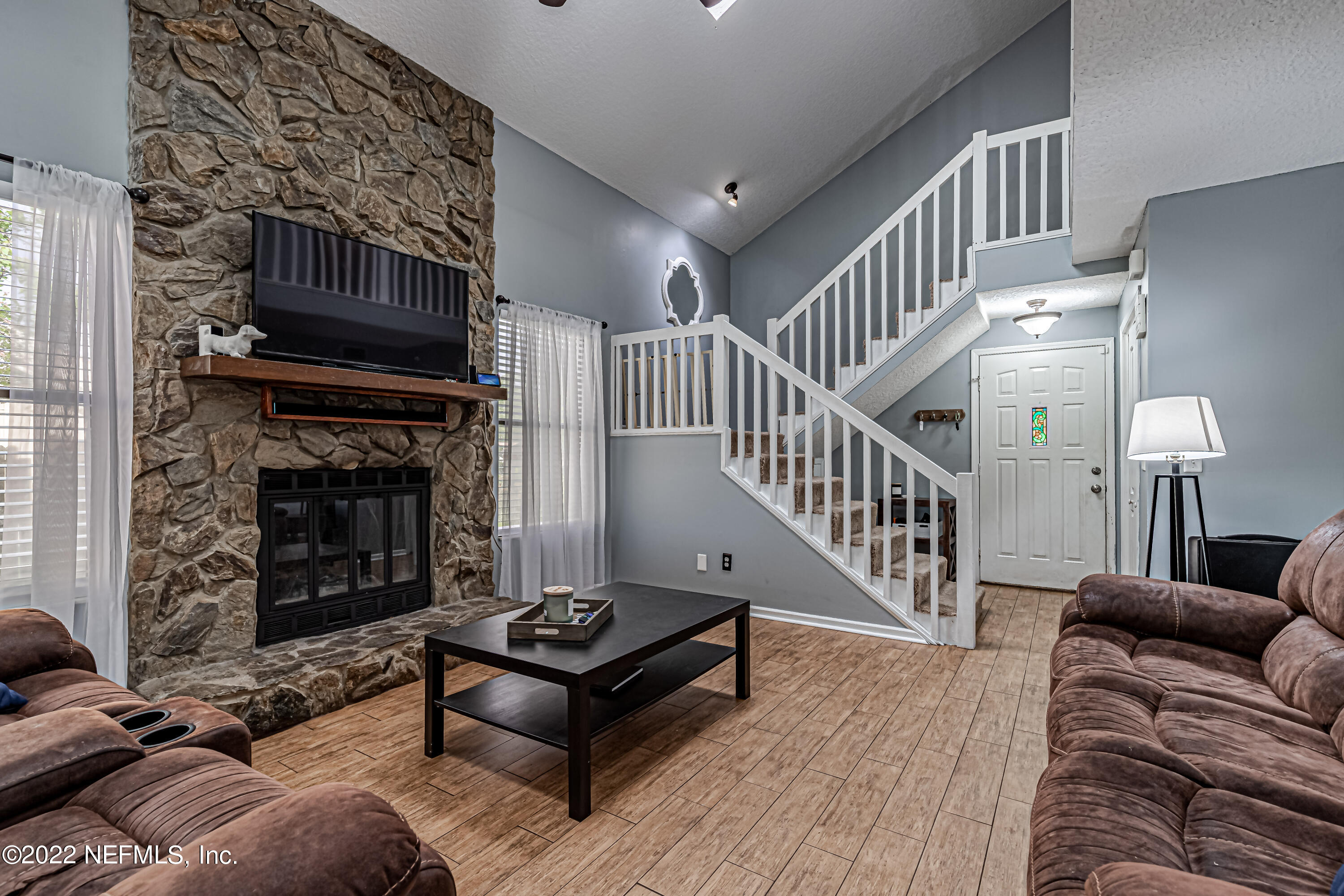 554 George Taylor Street Orange Park, FL 32073 - Photo 11 of 40 a living room with furniture and a fireplace