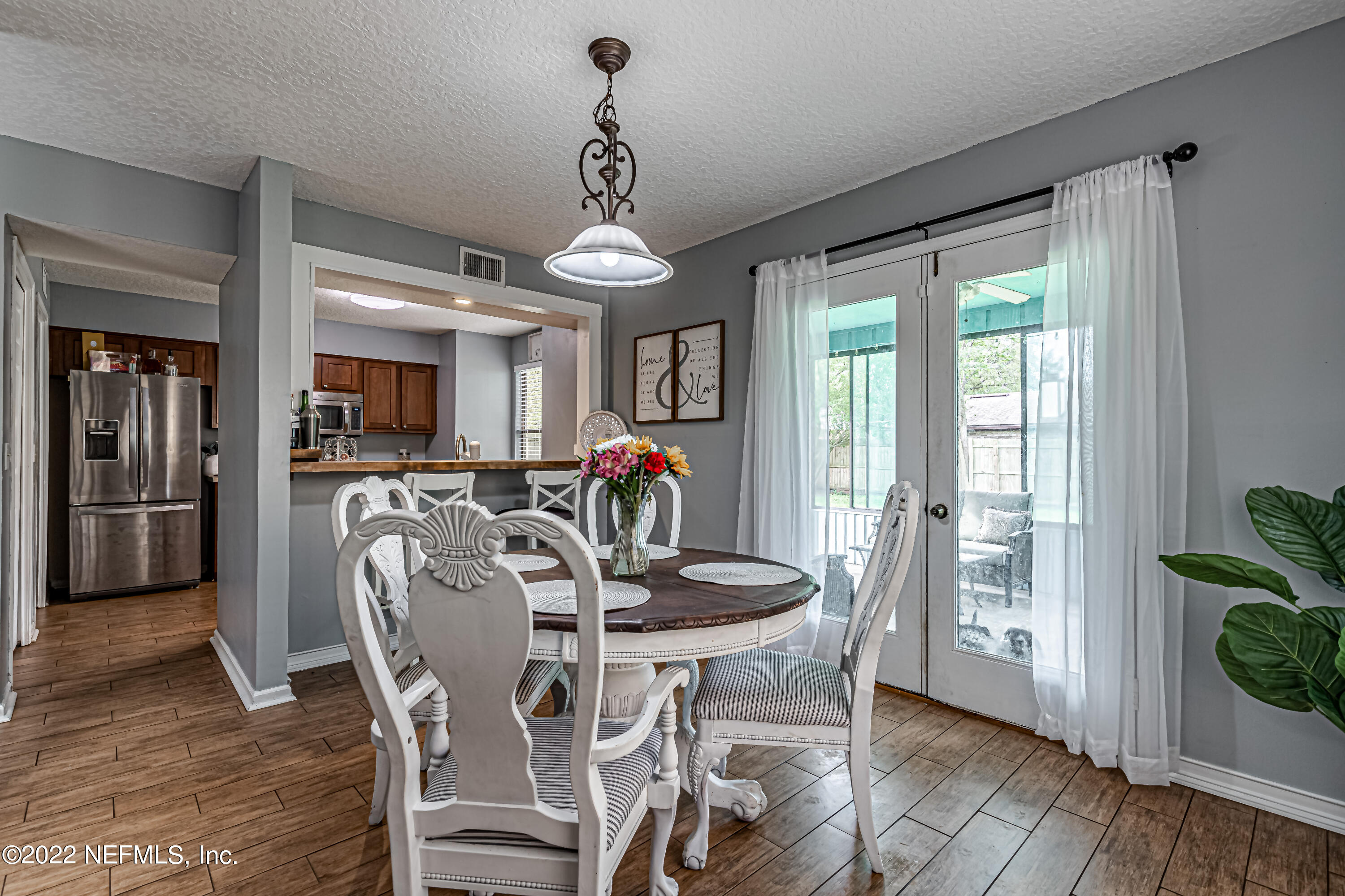 554 George Taylor Street Orange Park, FL 32073 - Photo 12 of 40 a view of a dining room with furniture window and wooden floor