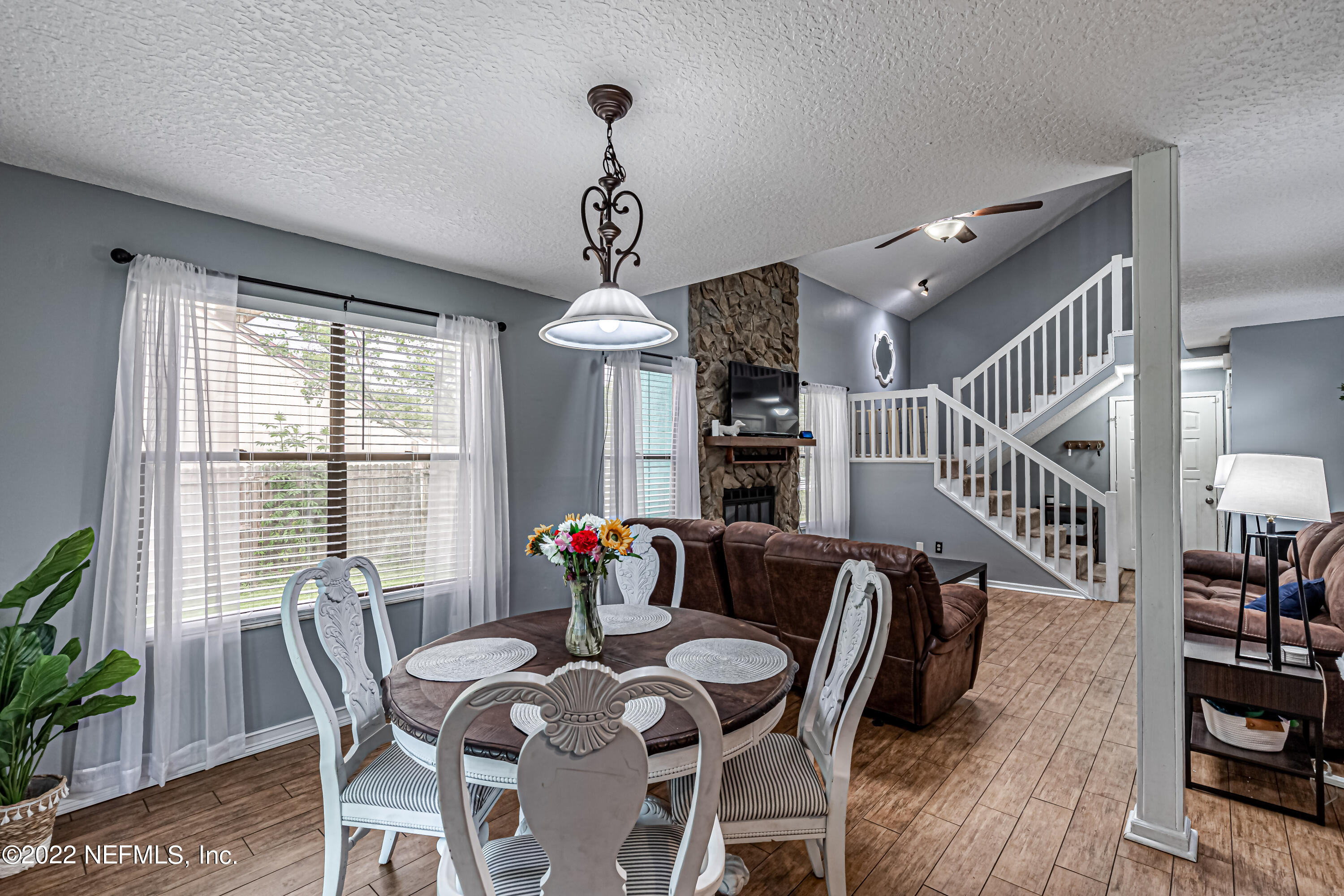 554 George Taylor Street Orange Park, FL 32073 - Photo 14 of 40 a view of a dining room with furniture window and wooden floor