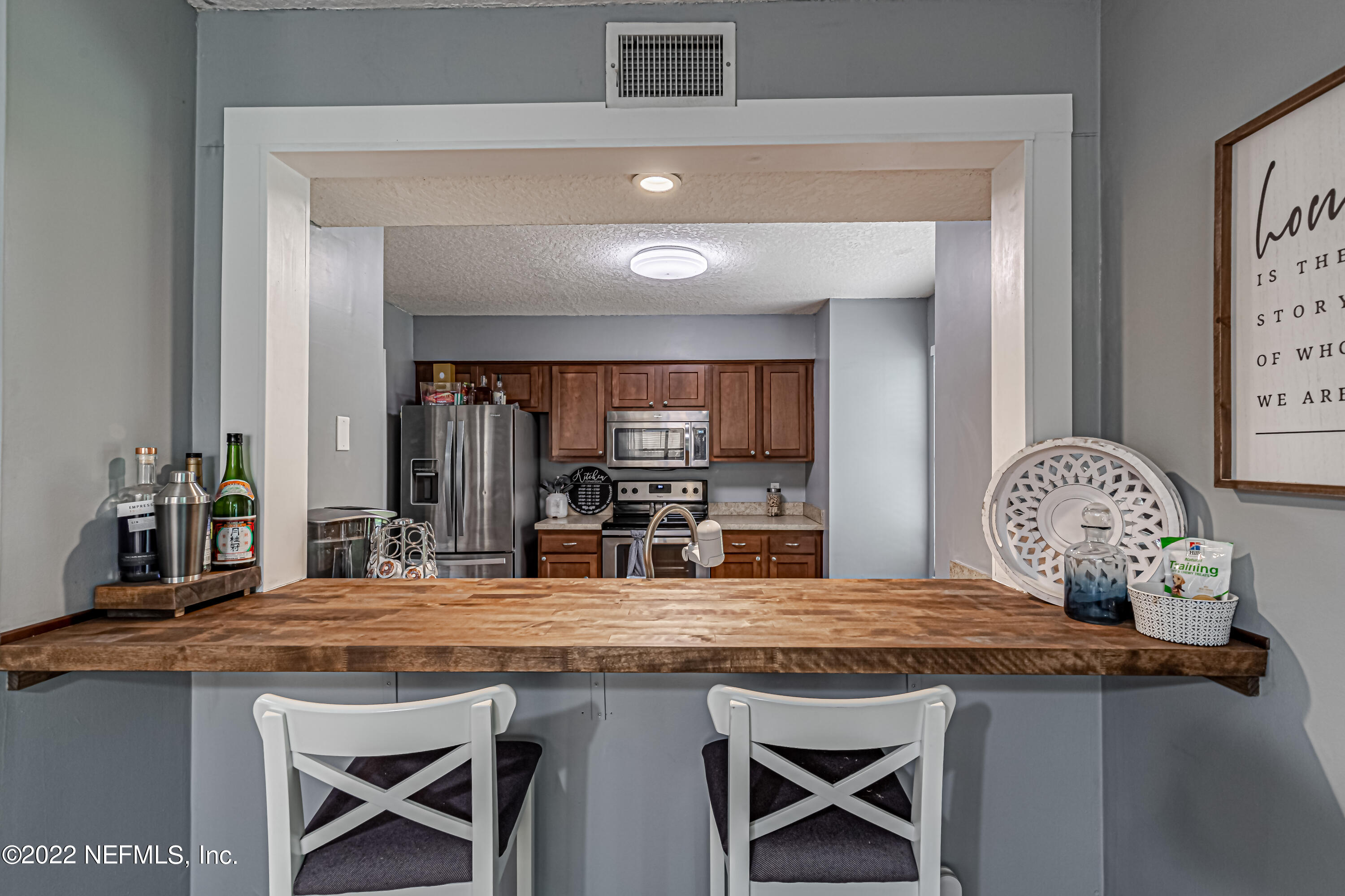 554 George Taylor Street Orange Park, FL 32073 - Photo 15 of 40 a kitchen with a table and chairs in it