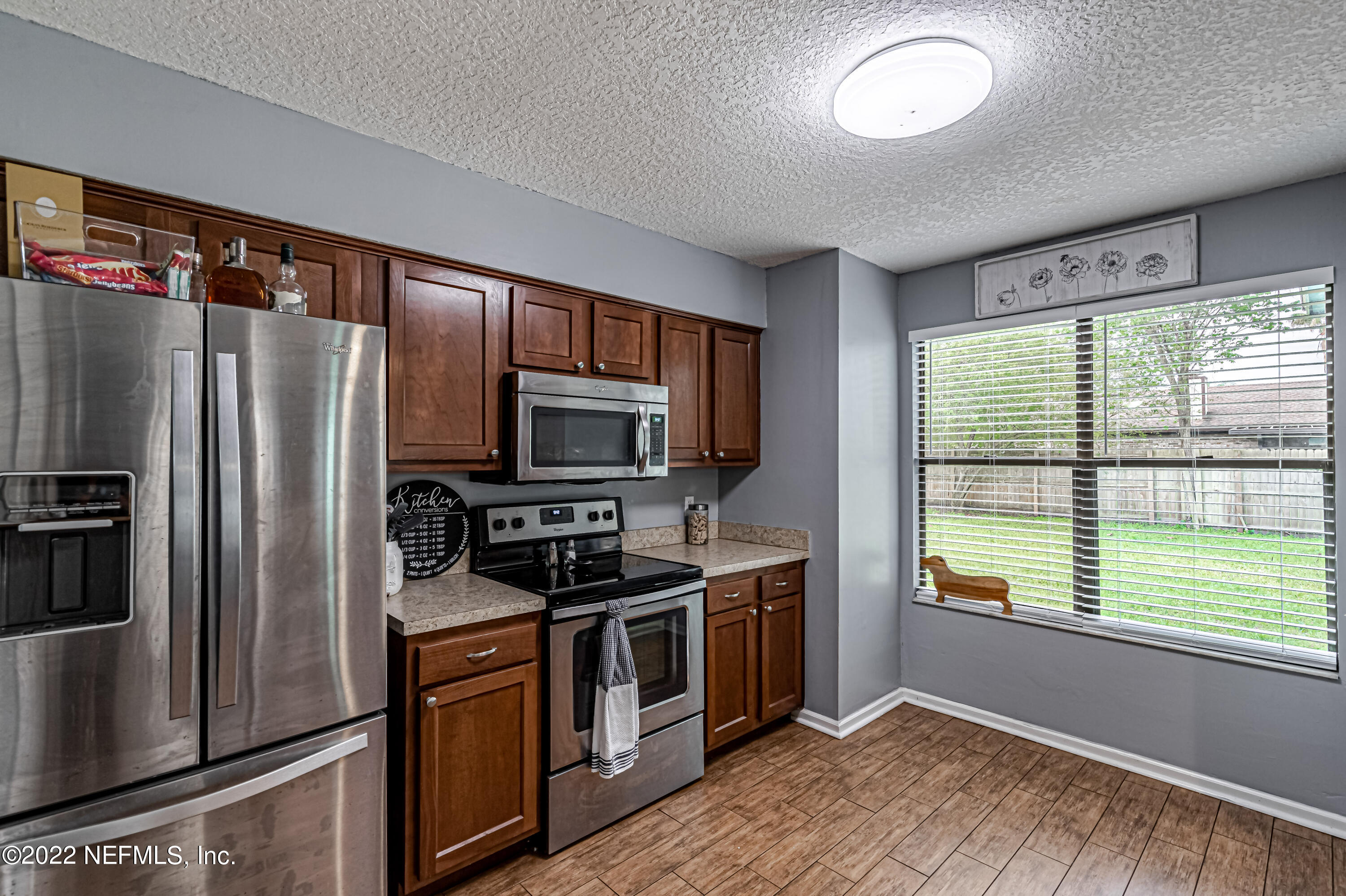 554 George Taylor Street Orange Park, FL 32073 - Photo 16 of 40 a kitchen with stainless steel appliances a refrigerator stove and sink