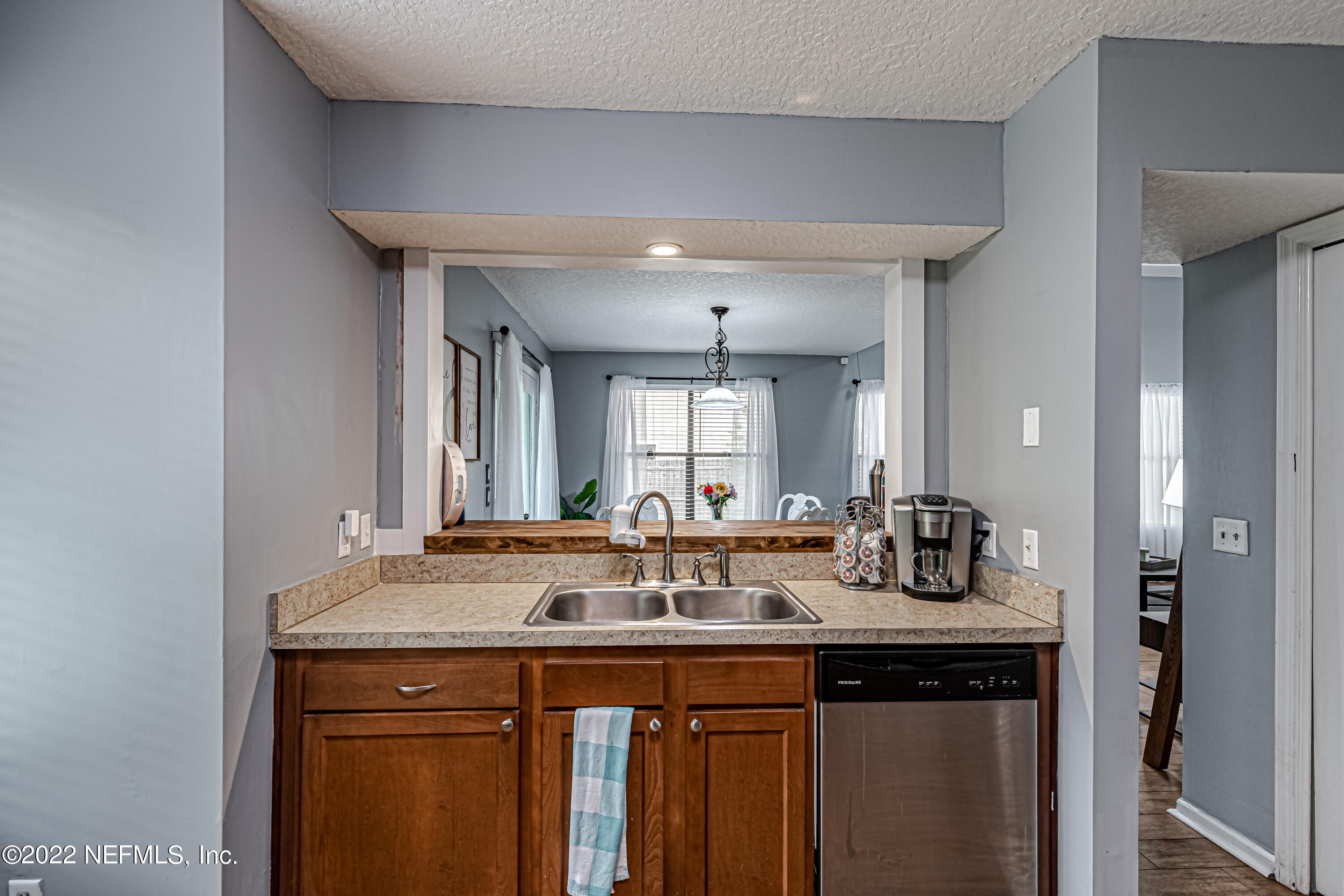 554 George Taylor Street Orange Park, FL 32073 - Photo 18 of 40 a sink with granite countertop a sink and cabinets