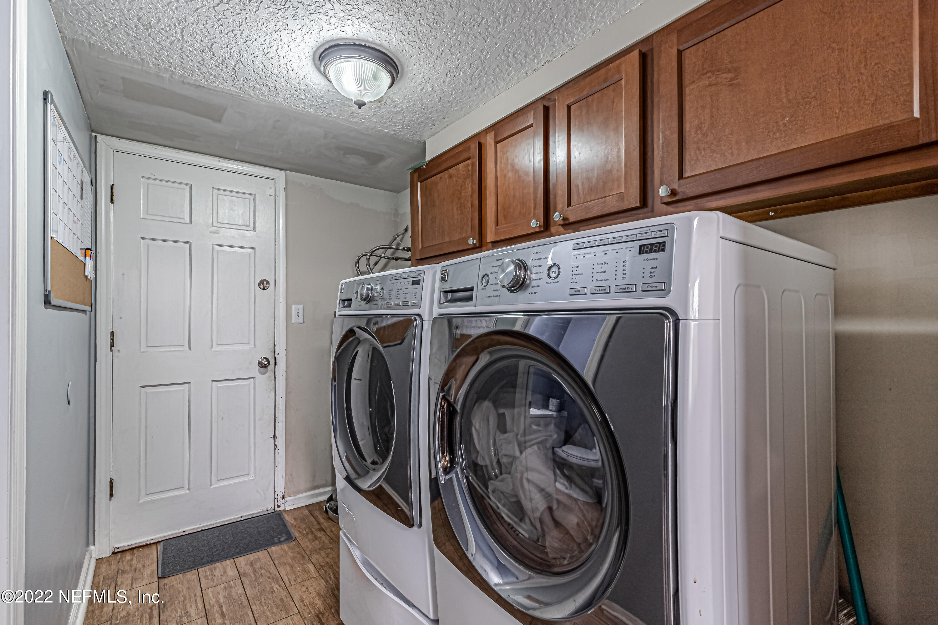 554 George Taylor Street Orange Park, FL 32073 - Photo 19 of 40 a view of hallway with washer and dryer