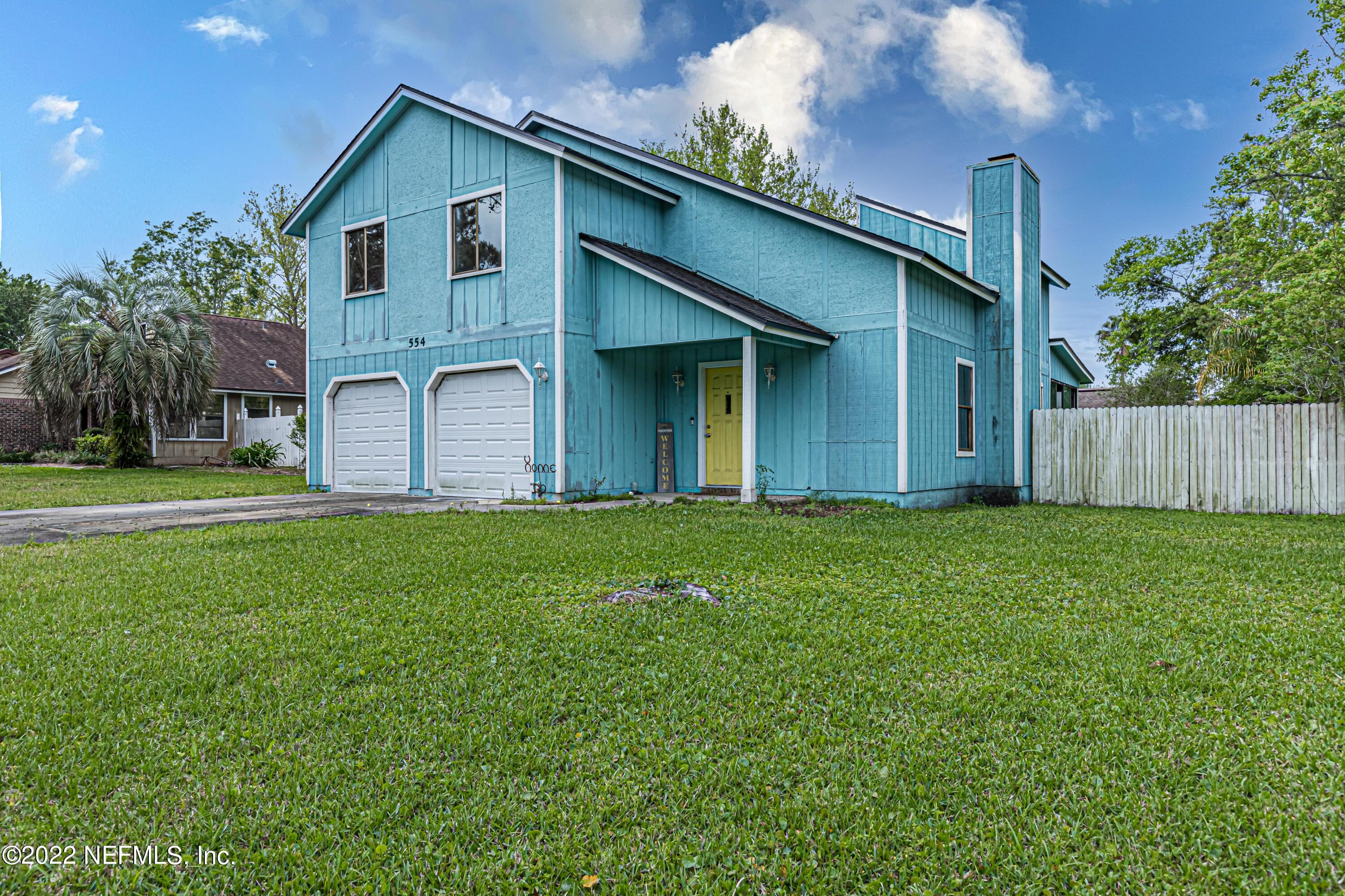 554 George Taylor Street Orange Park, FL 32073 - Photo 2 of 40 a front view of house with yard and green space