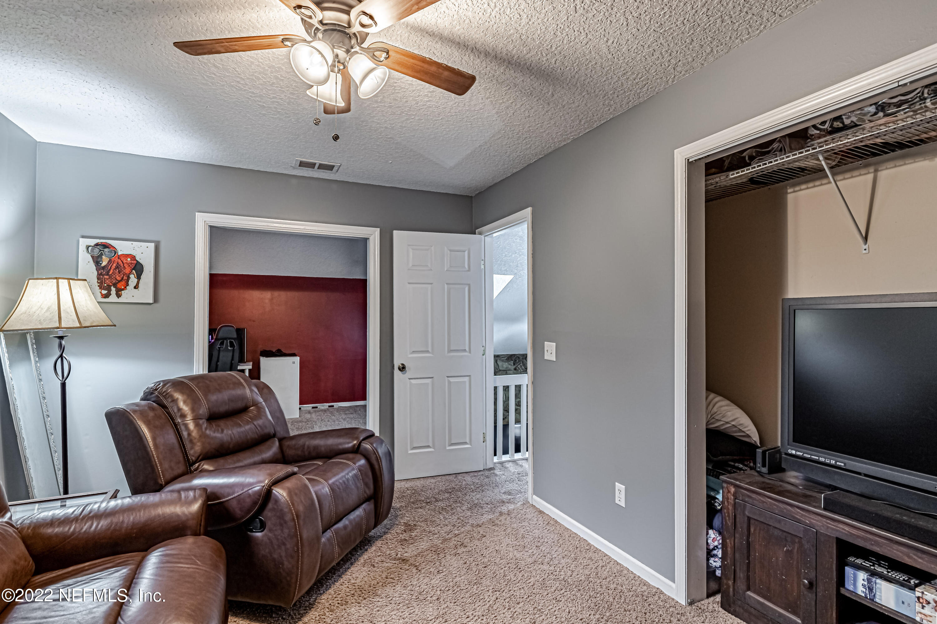 554 George Taylor Street Orange Park, FL 32073 - Photo 23 of 40 a living room with furniture and a flat screen tv