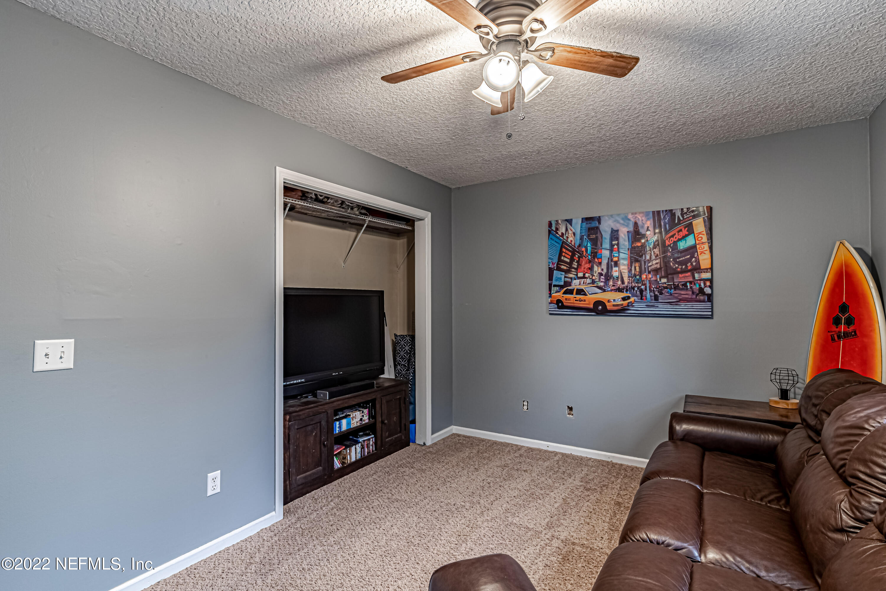 554 George Taylor Street Orange Park, FL 32073 - Photo 24 of 40 a living room with furniture and a flat screen tv