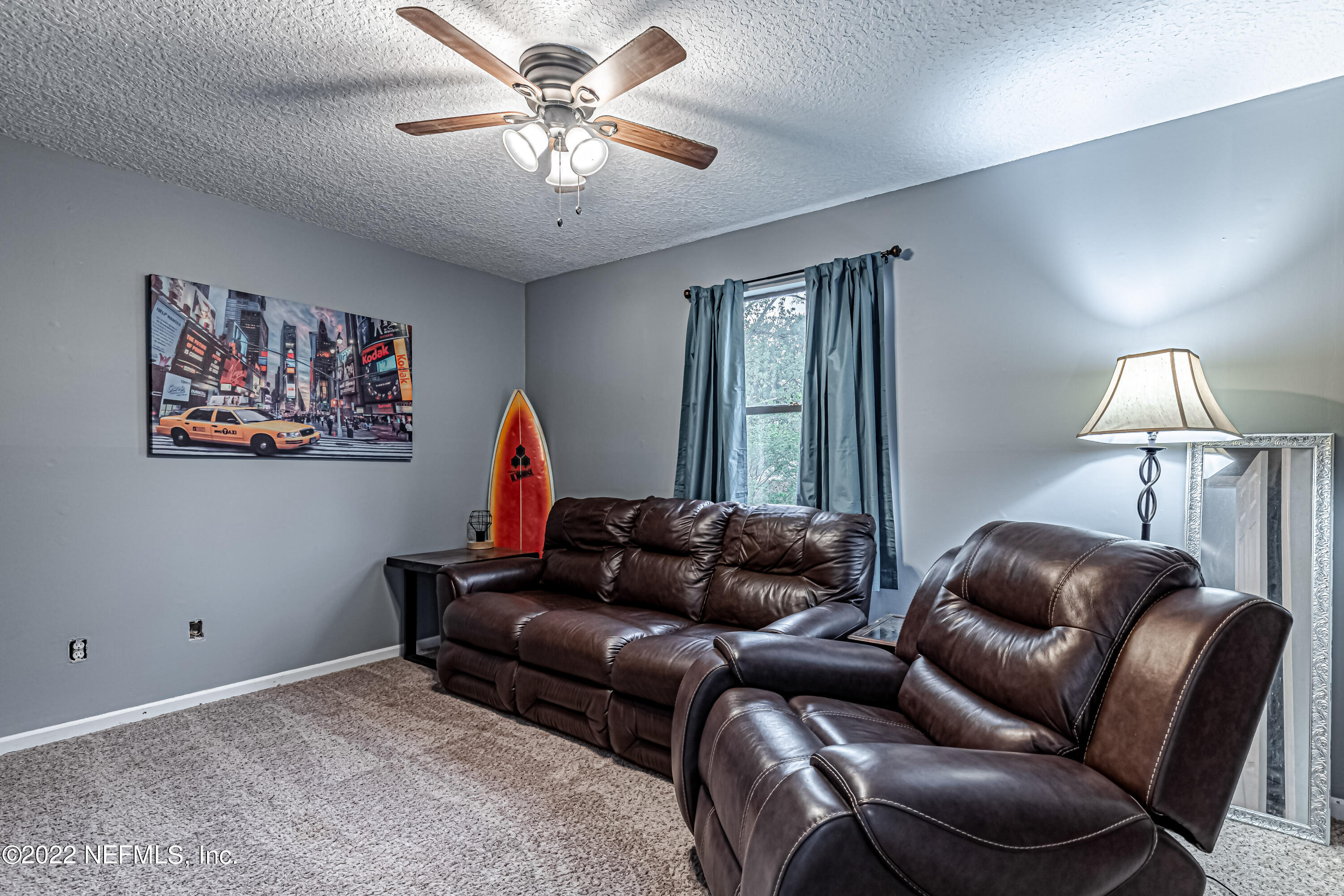 554 George Taylor Street Orange Park, FL 32073 - Photo 25 of 40 a living room with furniture a rug and a window