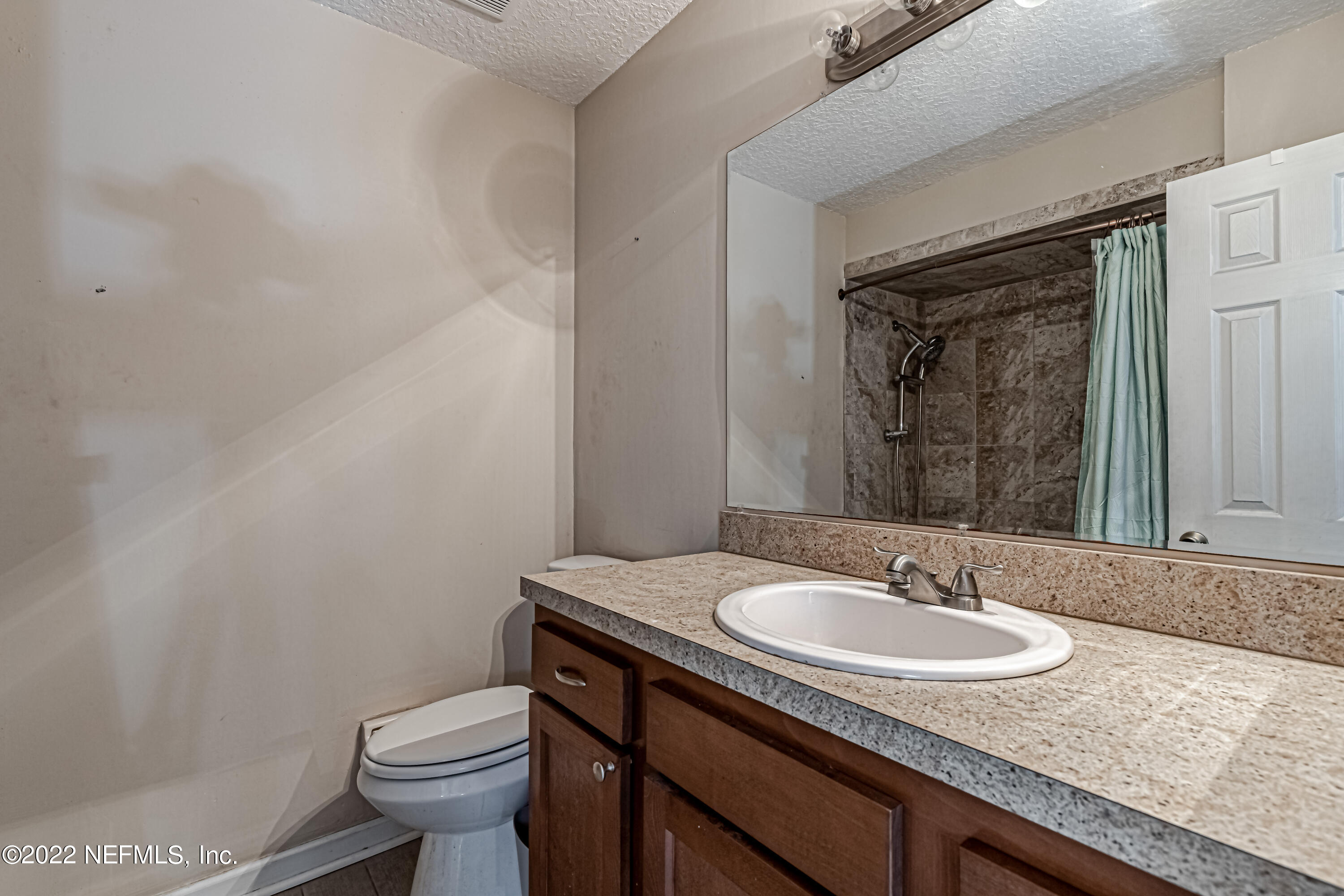 554 George Taylor Street Orange Park, FL 32073 - Photo 27 of 40 a bathroom with a granite countertop sink and a toilet