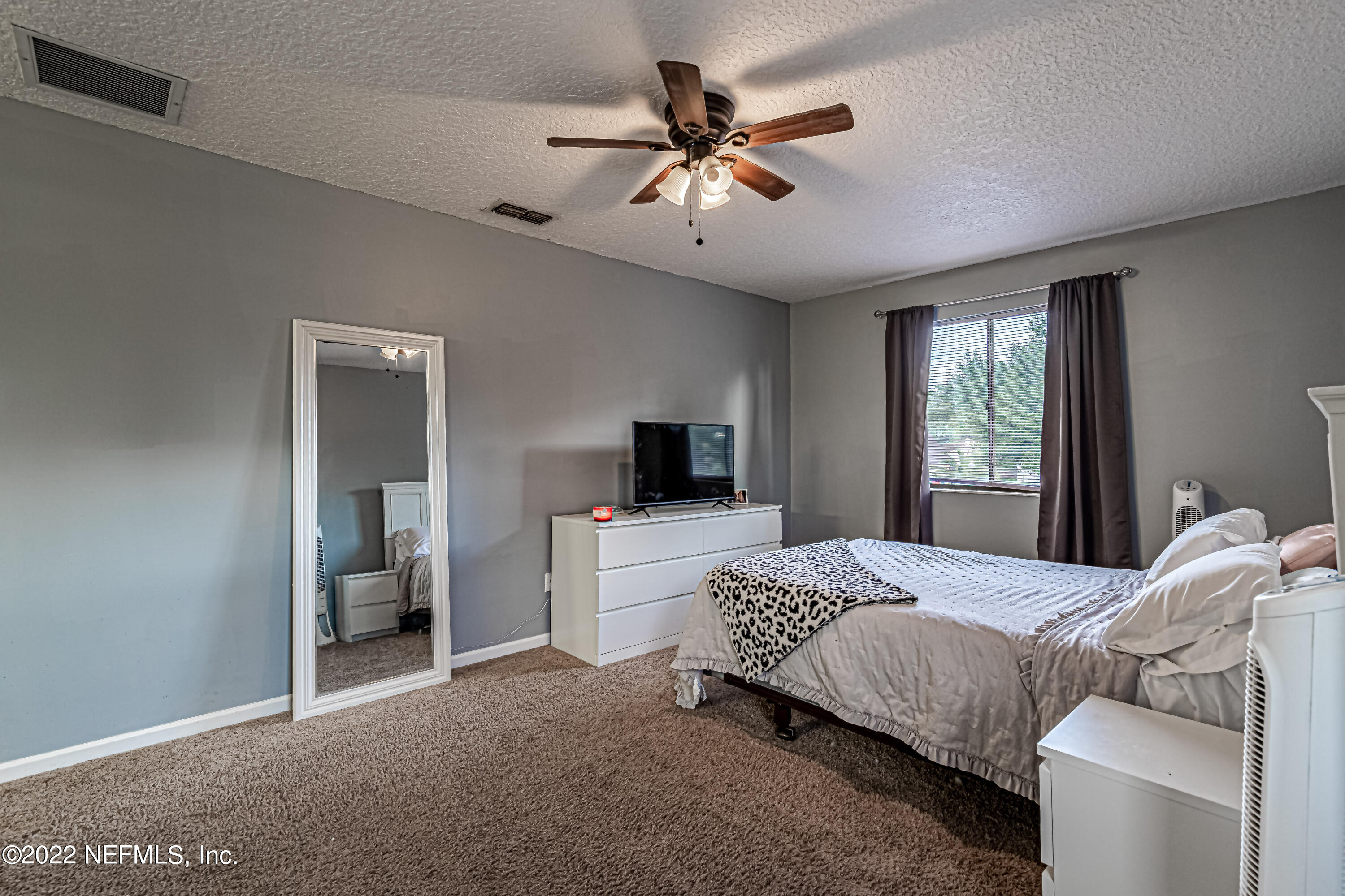 554 George Taylor Street Orange Park, FL 32073 - Photo 29 of 40 a bedroom with bed and a window