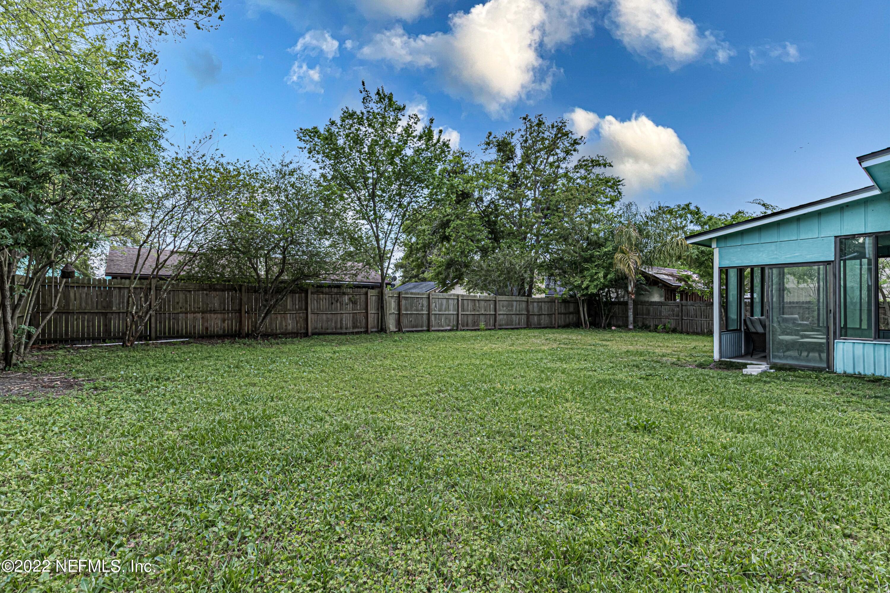 554 George Taylor Street Orange Park, FL 32073 - Photo 36 of 40 a view of a backyard with a garden and entertaining space