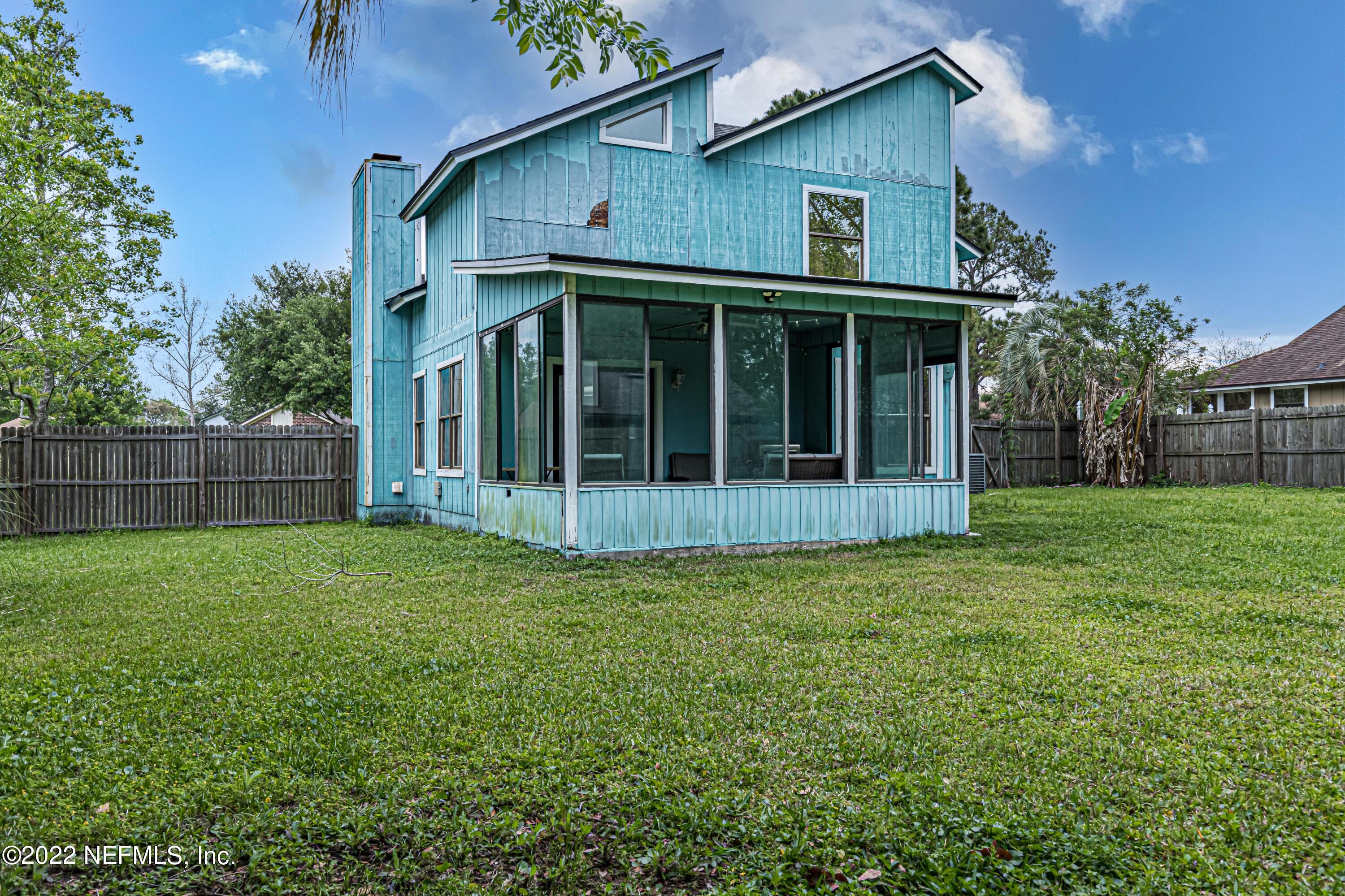 554 George Taylor Street Orange Park, FL 32073 - Photo 39 of 40 a view of an house with backyard space and balcony