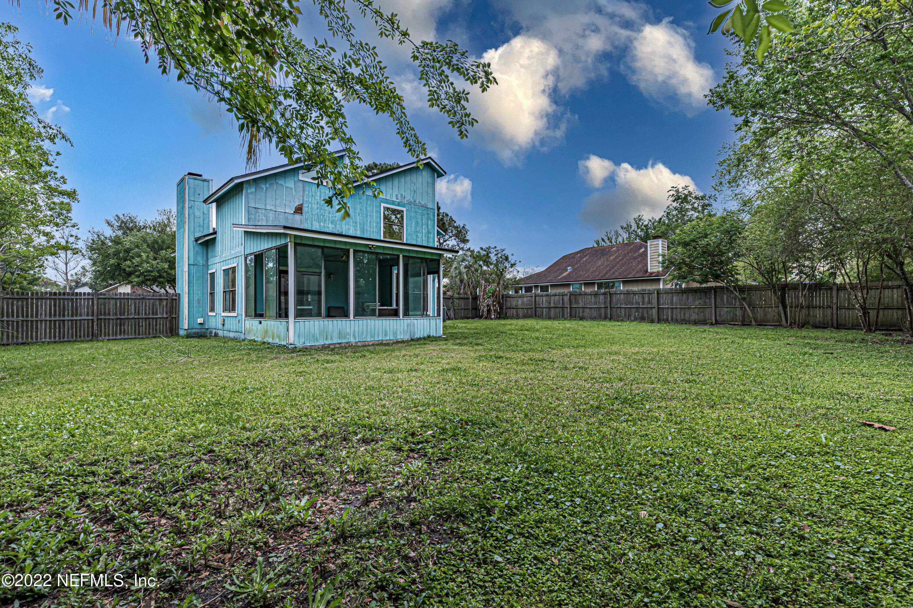 554 George Taylor Street Orange Park, FL 32073 - Photo 40 of 40 a view of a house with backyard and garden