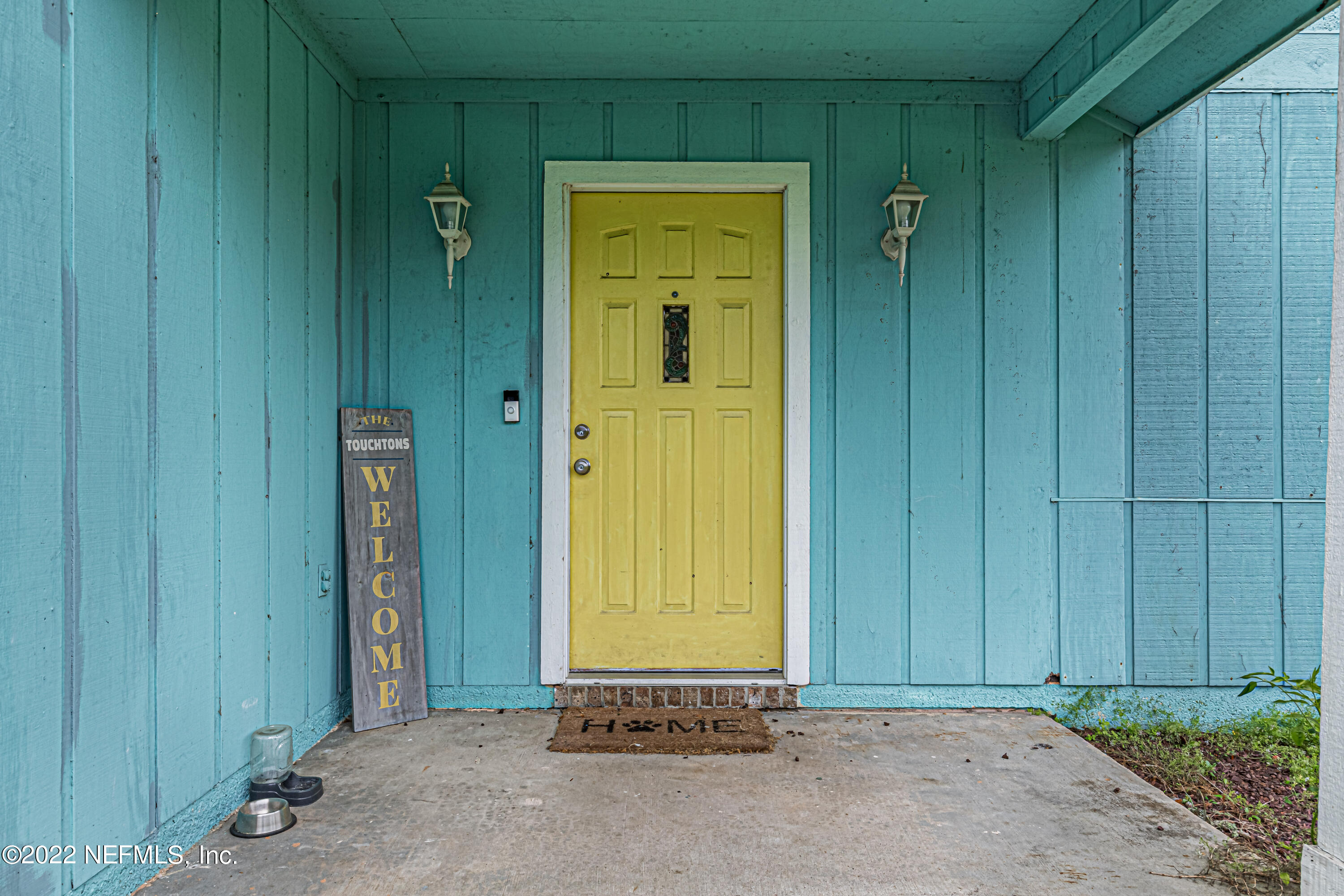 554 George Taylor Street Orange Park, FL 32073 - Photo 5 of 40 an empty room with windows and door