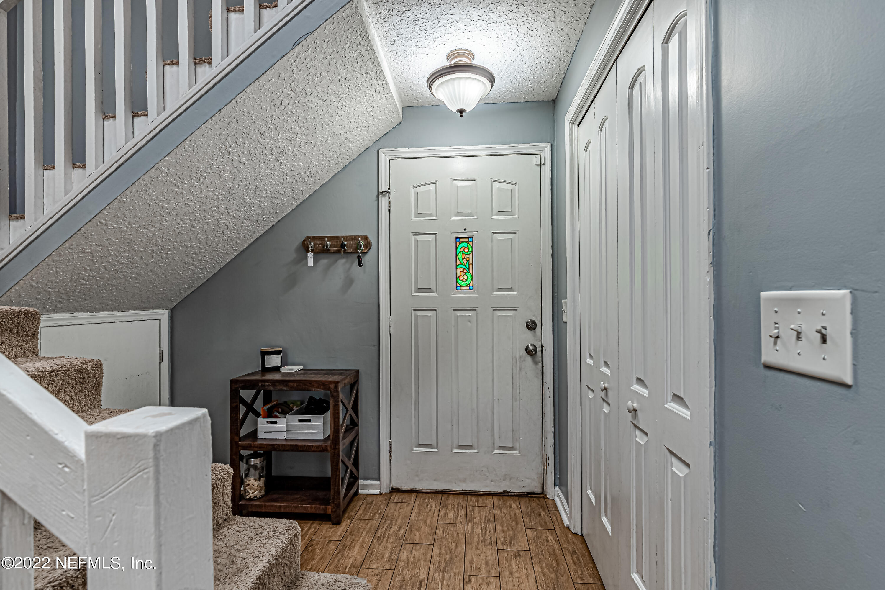 554 George Taylor Street Orange Park, FL 32073 - Photo 6 of 40 a view of a hallway with workspace to livingroom with furniture and windows