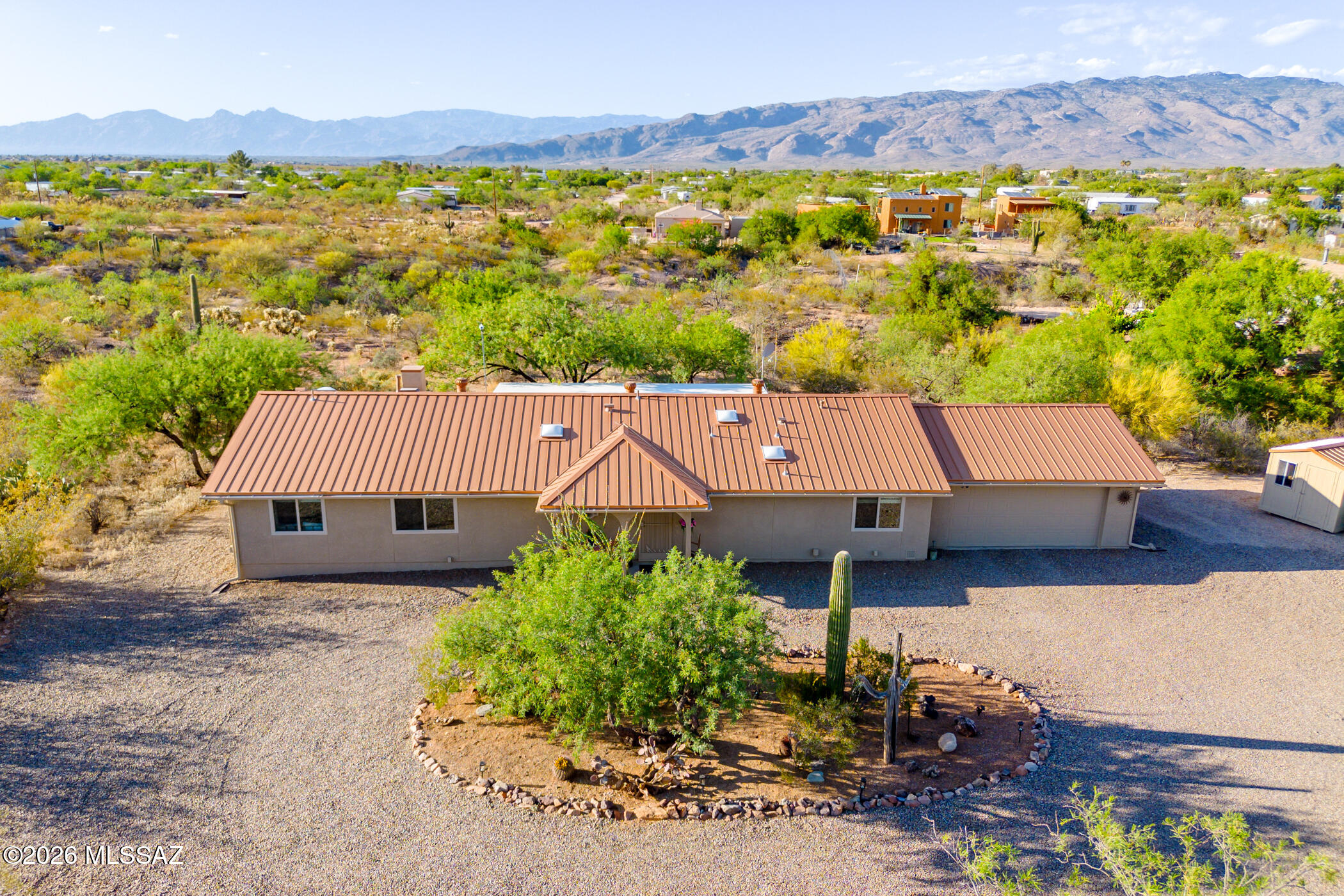 13599 East Rincon Ranch Road Vail, AZ 85641 - Photo 1 of 41 an aerial view of a house with a yard and lake view
