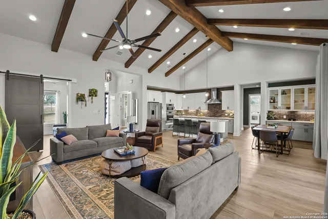 a bedroom with a bed and flat screen tv