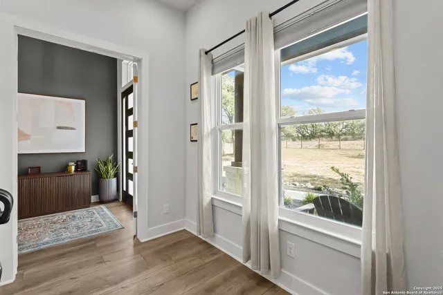 a large bathroom with a large mirror and a sink