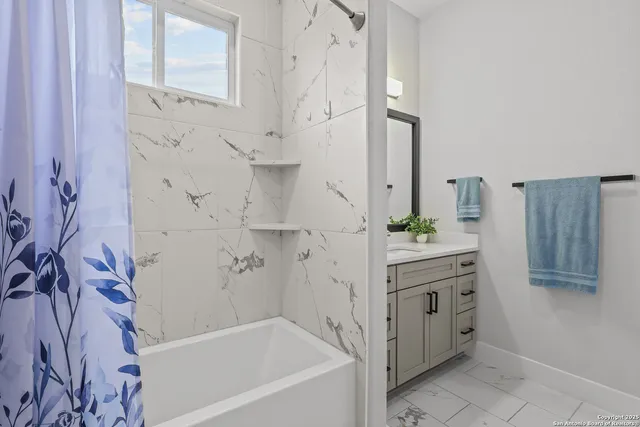 an aerial view of residential house with parking space