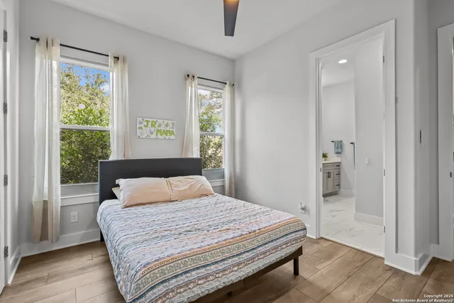 an aerial view of a house with a yard and lake view