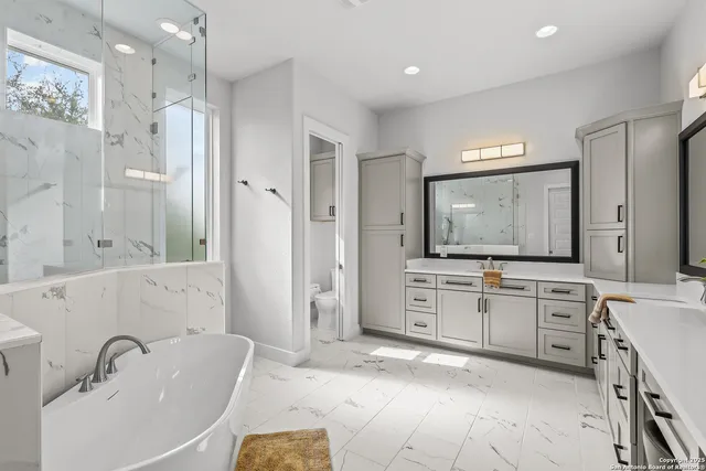 a view of a livingroom with furniture and a flat screen tv