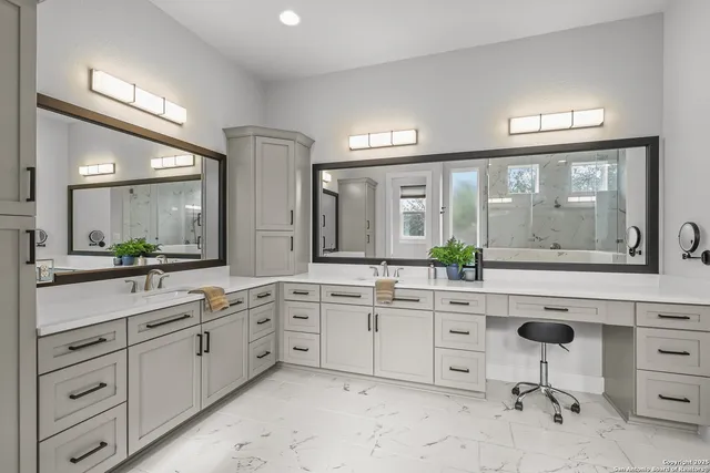 a living room with furniture kitchen view and a wooden floor