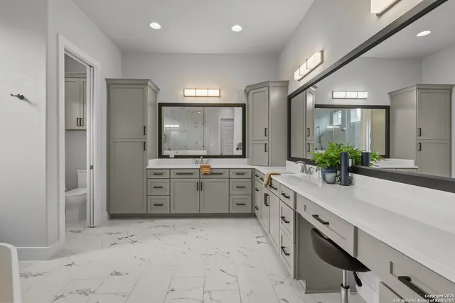 a kitchen with stainless steel appliances granite countertop sink stove refrigerator and cabinets