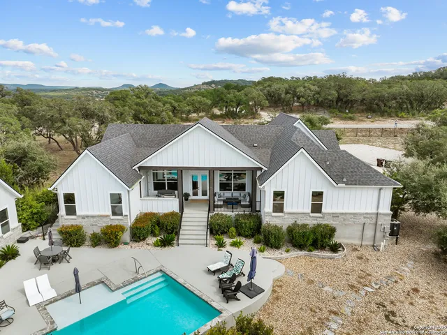 a bedroom with a bed and a flat screen tv in it