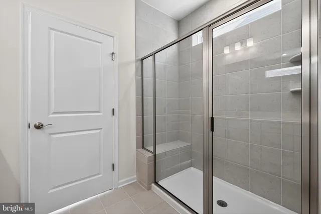 a bathroom with a glass shower door