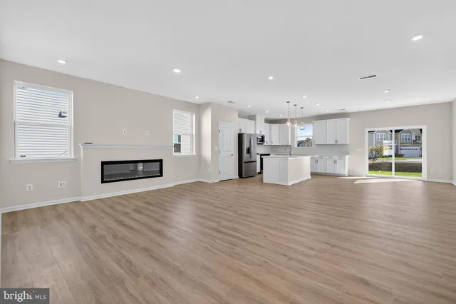 a view of kitchen and wooden floor