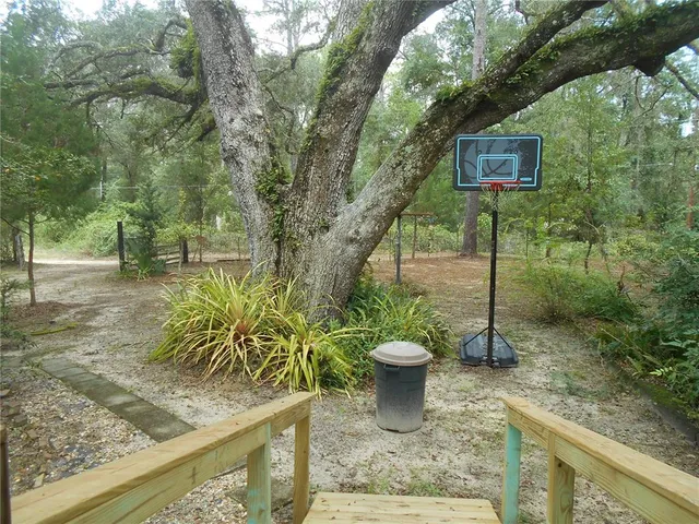 a room with a window and wooden floor