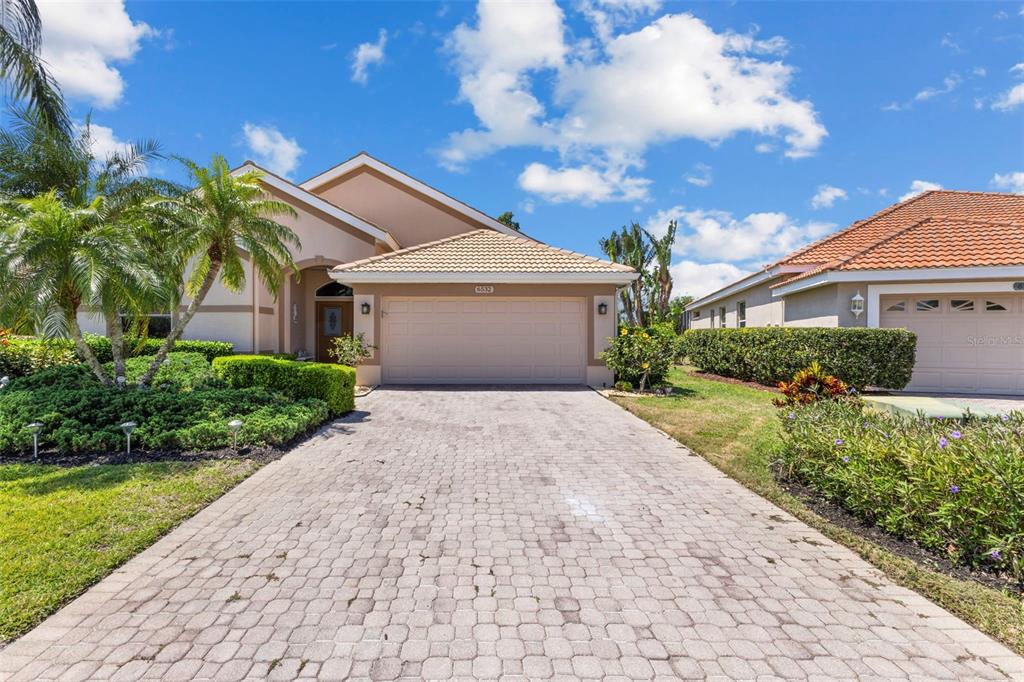 6532 Copper Ridge Trail Bradenton, FL 34201 - Photo 7 of 42 Paved driveway with 2 car garage