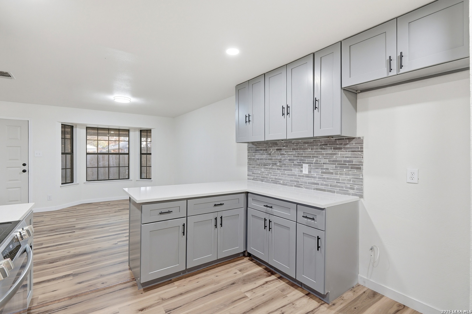 1300 Cyrus Schertz, TX 78154 - Photo 11 of 30 a kitchen with a sink cabinets and wooden floor