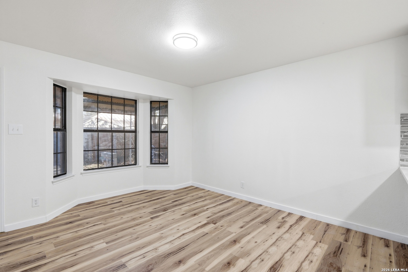 1300 Cyrus Schertz, TX 78154 - Photo 14 of 30 a view of empty room with wooden floor and fan