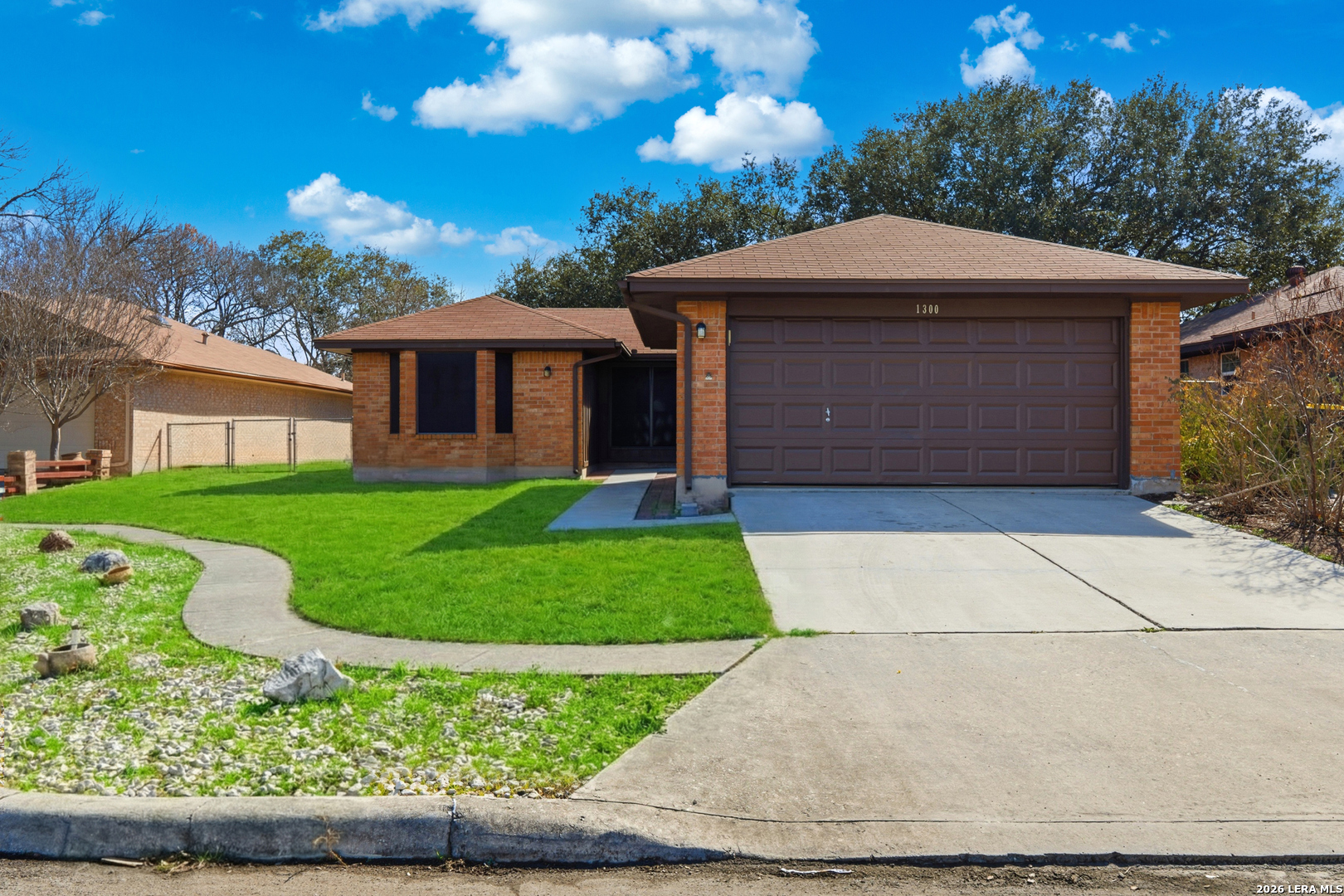 1300 Cyrus Schertz, TX 78154 - Photo 2 of 30 a front view of a house with a yard and garage
