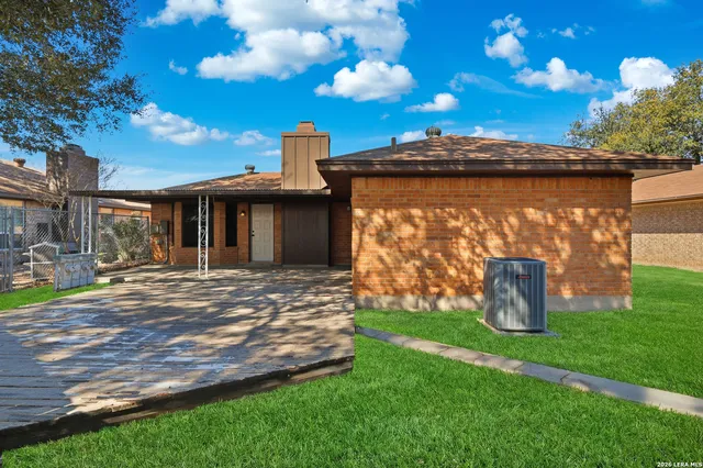 a view of a garden with a bench